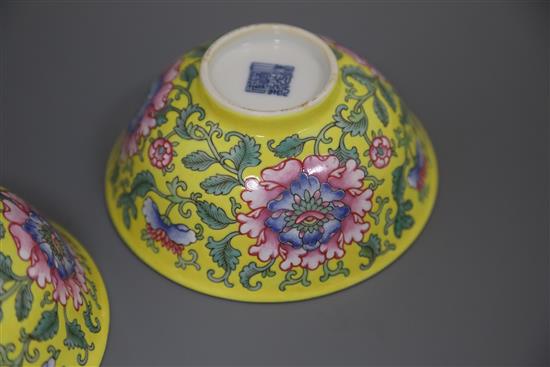 A pair of Chinese yellow ground famille rose bowls, Daoguang six character seal mark and probably of the period (1821-50), Diam.11.5cm